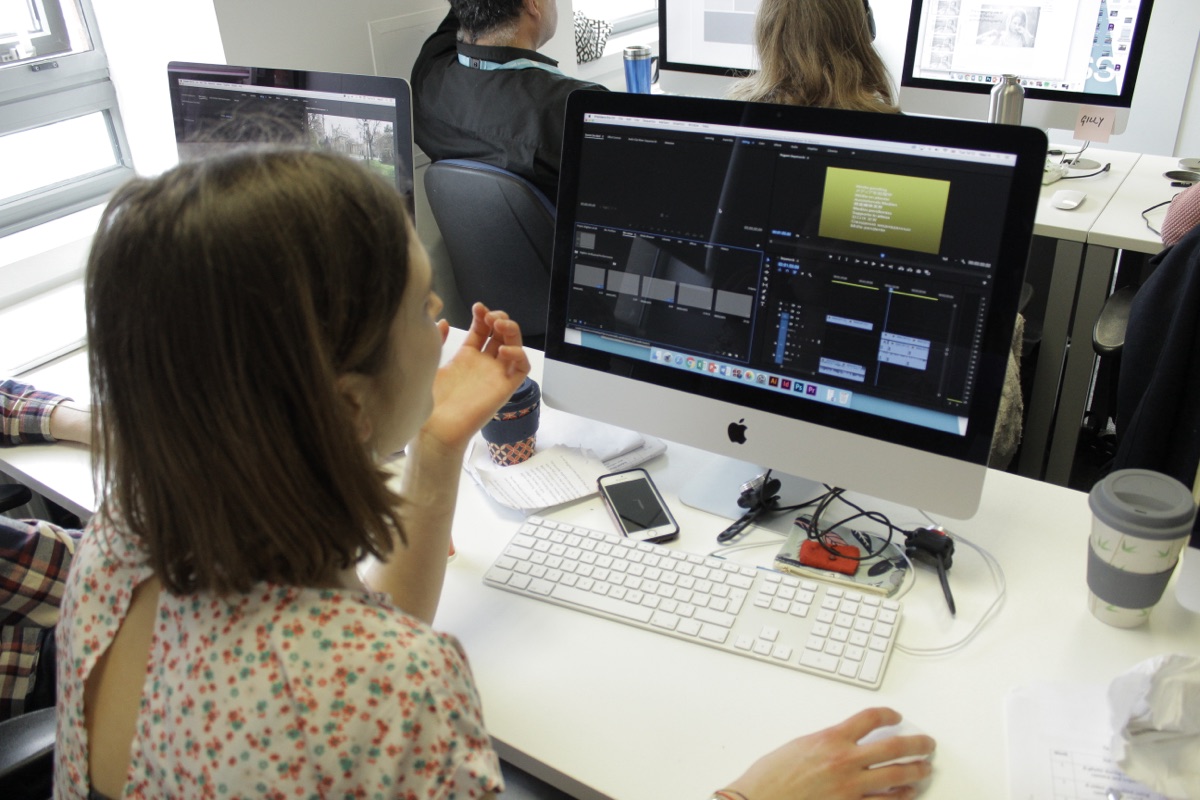 A live cohort working on iMacs during a CPD video editing session at Telecom House, Brighton